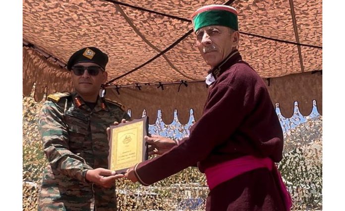 A Kargil War veteran being felicitated by the Army in Ladakh on Thursday. — Excelsior/ Basharat Ladakhi
