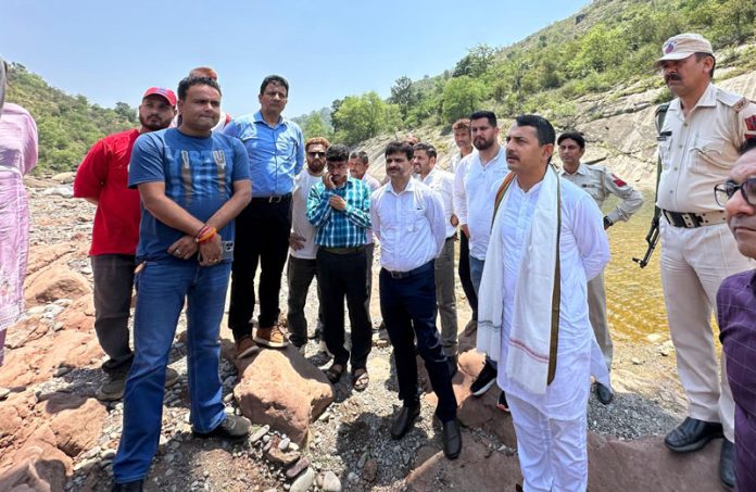 MLA from Udhampur East, R S Pathania along with locals in Battal area of Udhampur.