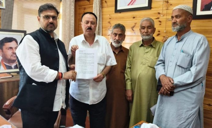 Minister Satish Sharma receiving a memorandum from a deputation at Srinagar on Thursday.