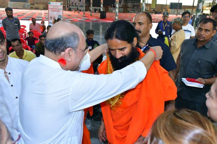 Swami Ramdev during a free artificial limb camp at Haridwar on Sunday.