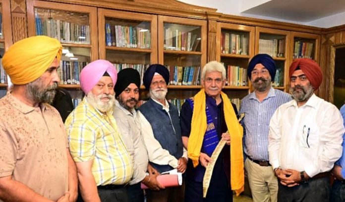 Delegation of Gurudwara Prabandhak Committee, Baramulla meeting LG, Manoj Sinha in Srinagar on Monday.