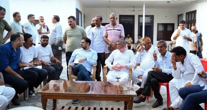 Minister Satish Sharma holding a meeting at Chhamb on Saturday. Minister Satish Sharma holding a meeting at Chhamb on Saturday.