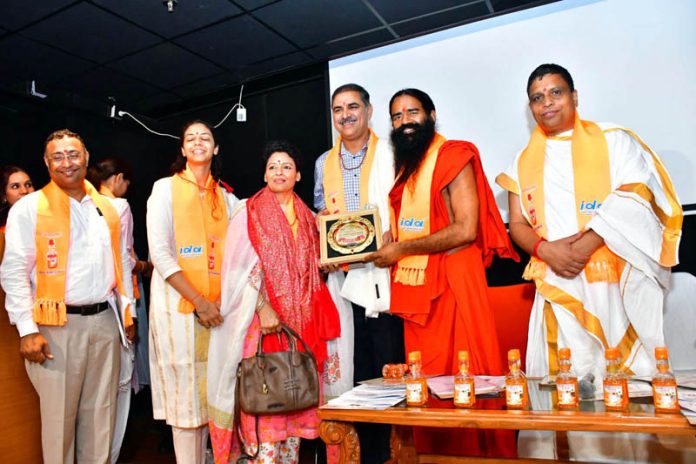 Swami Ramdev and others launching 'Dant Kanti Gandush Oil Pulling' on Monday.