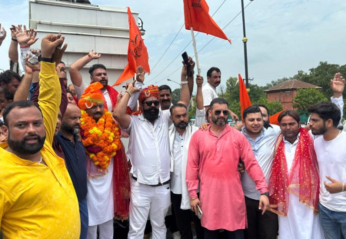 Newly elected YRS president Sanjeev Singh Rinku along with his supporters at Maharaja Hari Singh statue in Jammu.