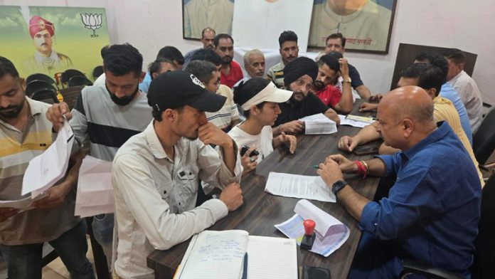 BJP MLA Yudhvir Sethi listening public grievances at Kacchi Chawni party office on Thursday.