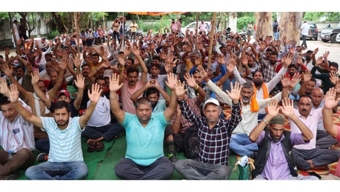 PDD daily rated workers sitting on 'dharna' outside JPDCL office at Bahu Plaza in Jammu. — Excelsior/Rakesh PDD daily rated workers sitting on 'dharna' outside JPDCL office at Bahu Plaza in Jammu. — Excelsior/Rakesh
