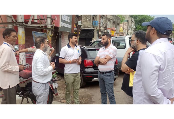 JMC Commissioner Dr Devansh Yadav interacting with sanitation workers and officials in Jammu City.