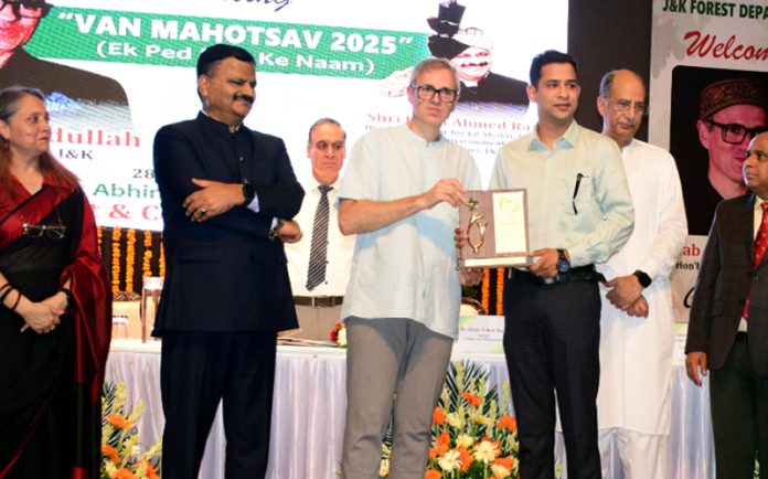 Social activist Nazakat Choudhary receiving award from CM Omar Abdullah.