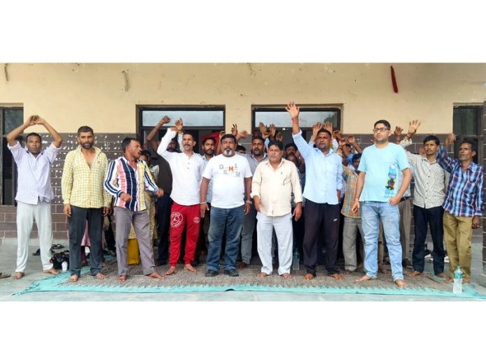 Safai Karamcharis protesting in front of the office of Municipal Committee Udhampur on Tuesday.
