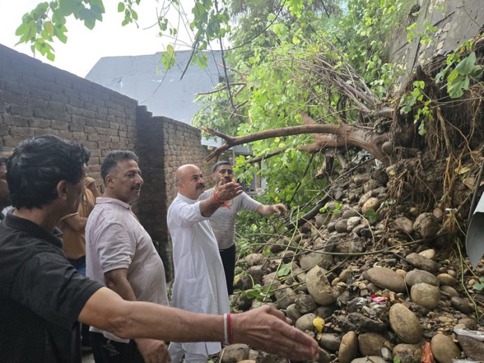 MLA Jammu East, Yudhvir Sethi during visit to landslide affected area in Peer Kho on Monday.