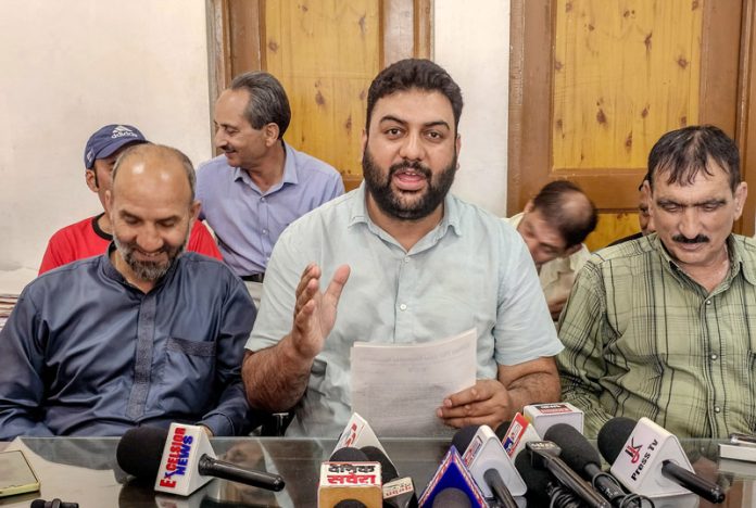 Members of Kashmir PHE Joint Employees Association during a press conference in Srinagar on Monday. -Excelsior/Shakeel
