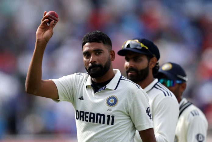 Mohd Siraj showing ball after taking six wickets against England.