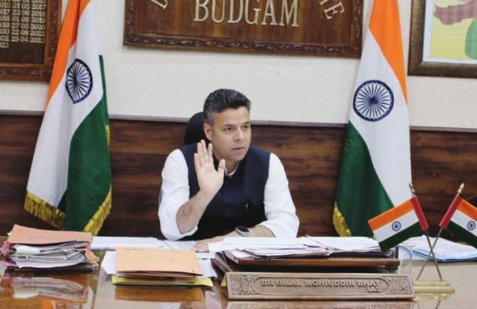 DC Budgam Dr Bilal Mohi-ud-Din Bhat chairing a detailed review meeting on Friday.