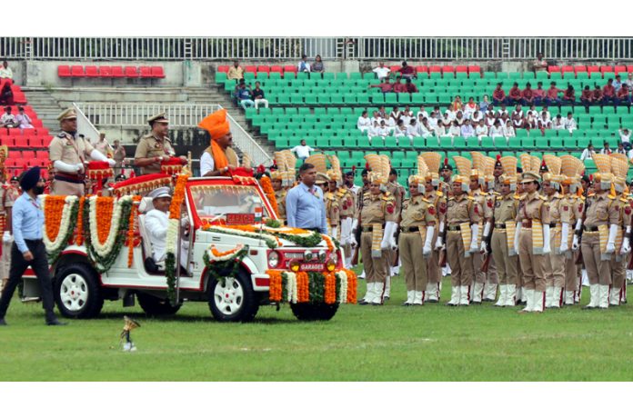 Deputy CM inspecting Independence Day Parade at MA Stadium. -Excelsior/Rakesh