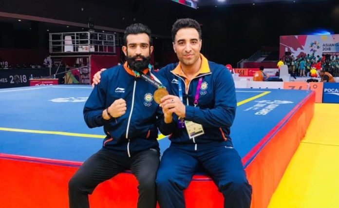Surya Bhanu Partap Singh posing along with coach Kuldeep Handoo.