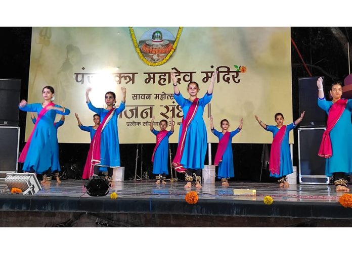 Artists performing at Panjvaktra Mahadev Mandir on Monday.
