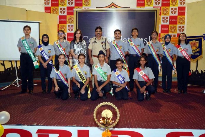 Newly elected Student Council members of J P World School posing with Farooq Qaiser, SSP Traffic Police Jammu.