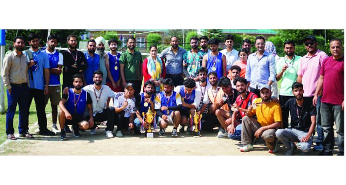 Winners of various sports events posing with guests and officials at KU Campus in Srinagar.