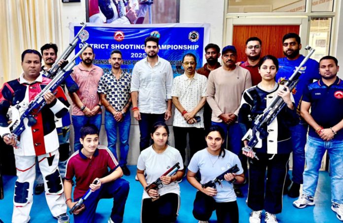 Winners in different categories of shooting events posing with officials. Winners in different categories of shooting events posing with officials.