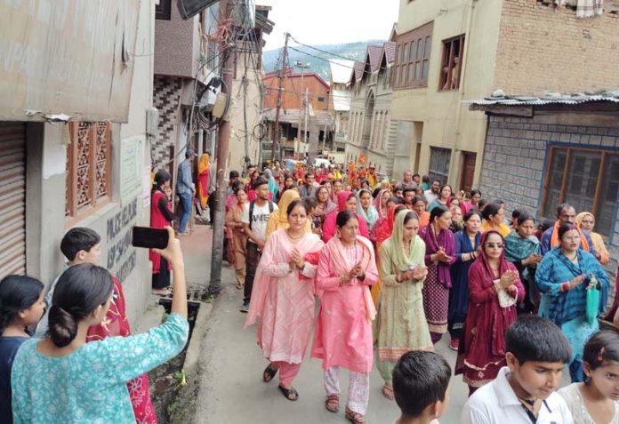 Devotees proceeding towards the shrine of Manimahesh in Bharmour district of Himachal Pradesh from Bhaderwah on Sunday. -Excelsior/Tilak Raj Devotees proceeding towards the shrine of Manimahesh in Bharmour district of Himachal Pradesh from Bhaderwah on Sunday. -Excelsior/Tilak Raj