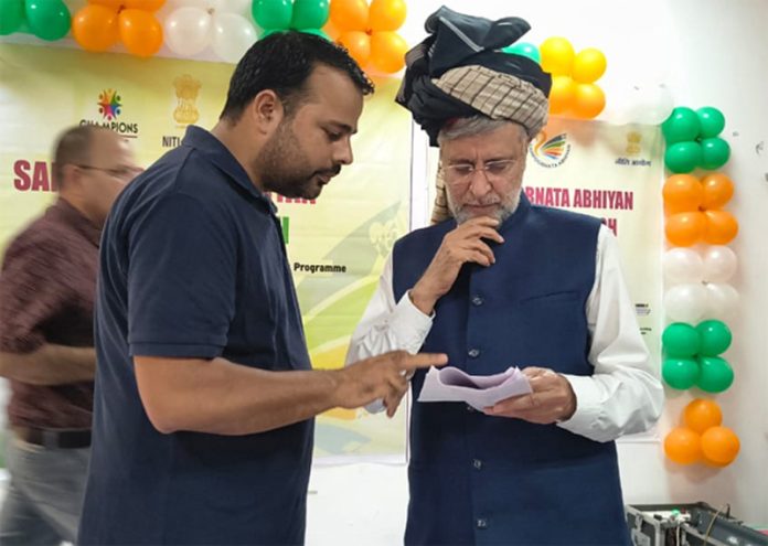 Thannamandi Press Council president Imran Khan sharing a document regarding Rajouri-Thanna-Surankote road project with MP.