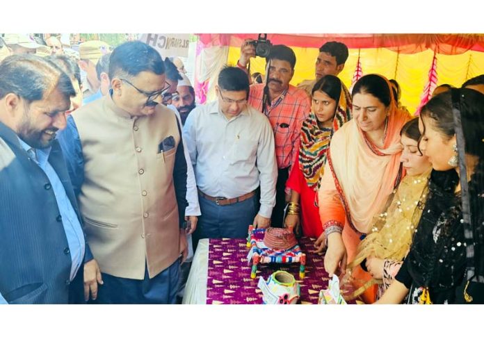 Minister Javed Rana inspecting a stall after launching akaanksha Haat in Poonch on Friday.