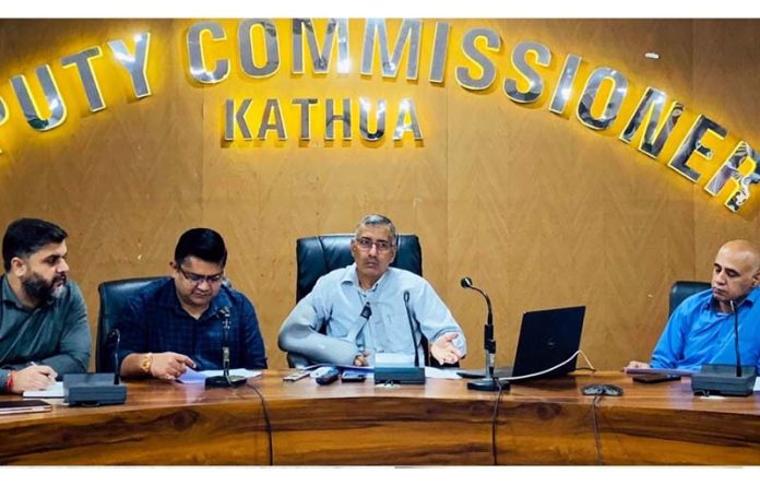 DC Kathua Rajesh Sharma chairing a meeting on Monday.