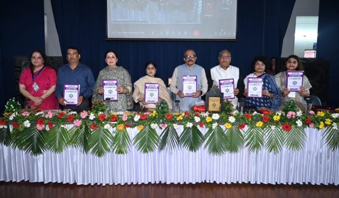 Guest on dais release a souvenir during inaugural of seminar at Cluster University Jammu.