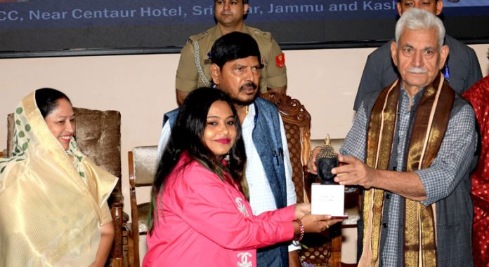 lg1 LG Manoj Sinha with Union Minister of State Ramdas Athawale felicitating an awardee in a function at SKICC on Saturday. —Excelsior/Shakeel
