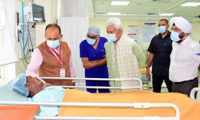 LG Manoj Sinha inquiring condition of an injured at Narayana Hospital, Katra on Wednesday.