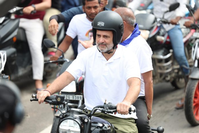 Leader of Opposition in Lok Sabha Rahul Gandhi riding motorcycle during his ‘Voter Adhikar Yatra’ in Araria on Sunday. (UNI). Leader of Opposition in Lok Sabha Rahul Gandhi riding motorcycle during his ‘Voter Adhikar Yatra’ in Araria on Sunday. (UNI).