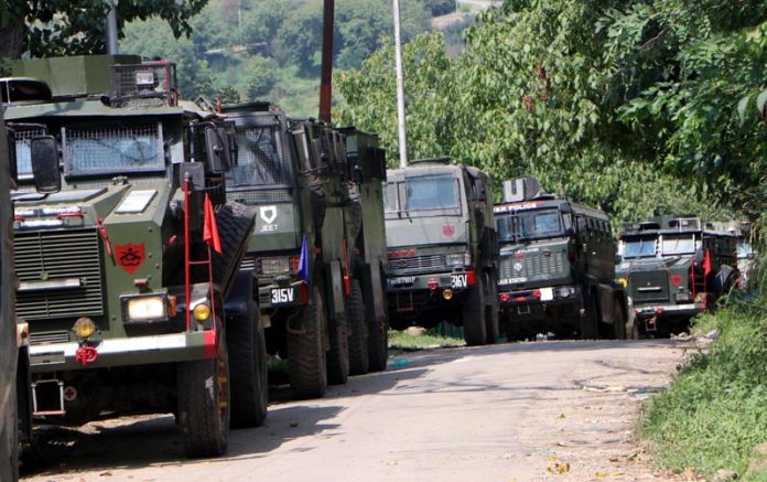 Security forces maintaining strict cordon around the Akhal forest range in Kulgam district on Tuesday.