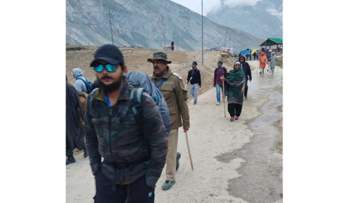 A thin number of pilgrims on way to holy cave for darshan on Saturday.