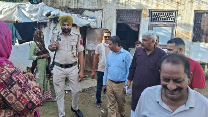 MLA Bharat Bhushan during visit to cloud burst hit areas of village Khokhyal in Kathua.
