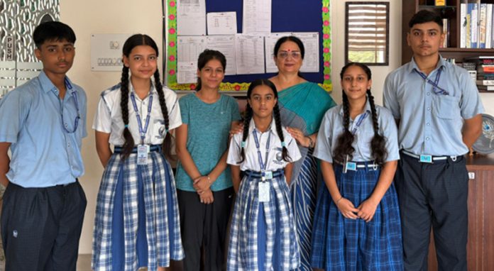 Students of Jammu Sanskriti School posing along with principal.
