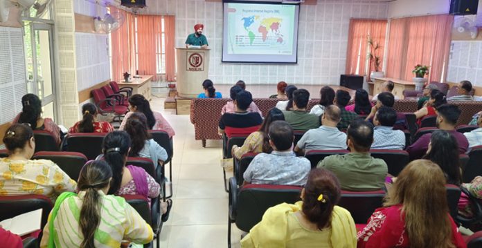 Resource person addressing during a programme.