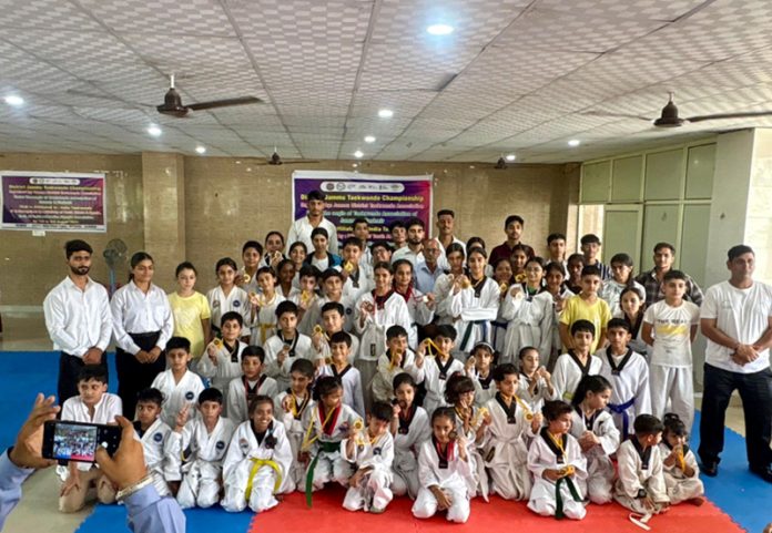 Taekwondo players posing along with medals during closing ceremony. Taekwondo players posing along with medals during closing ceremony.