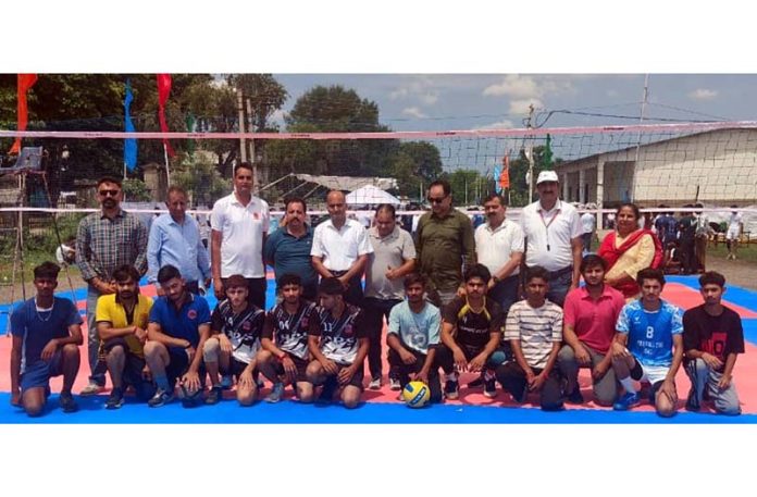 Volleyball players posing with match officials at Khel Gaon, Nagrota, Jammu.