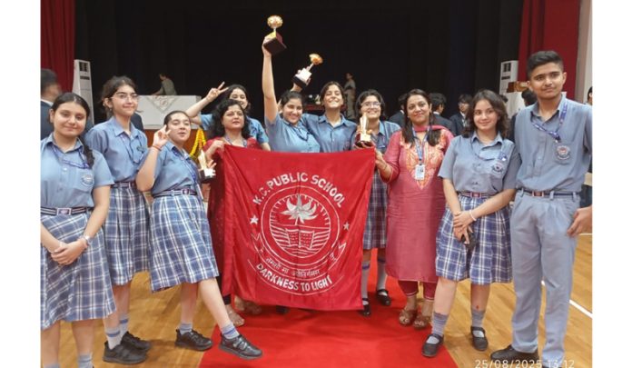KC Public School delegation posing along with trophies.