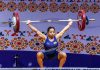 Mirabai Chanu lifting weight during Commonwealth Championship on Monday.