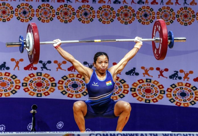Mirabai Chanu lifting weight during Commonwealth Championship on Monday. Mirabai Chanu lifting weight during Commonwealth Championship on Monday.