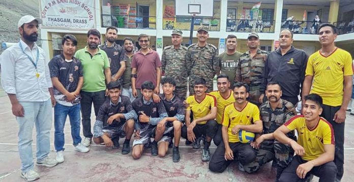 Vollyball team posing along with dignitaries at Drass. -Excelsior/Basharat Ladakhi Vollyball team posing along with dignitaries at Drass. -Excelsior/Basharat Ladakhi