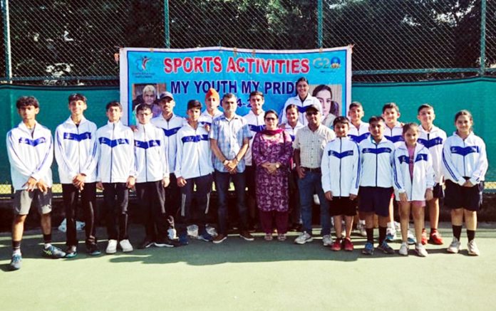 Dignitaries presenting kits to players at MA Stadium in Jammu.