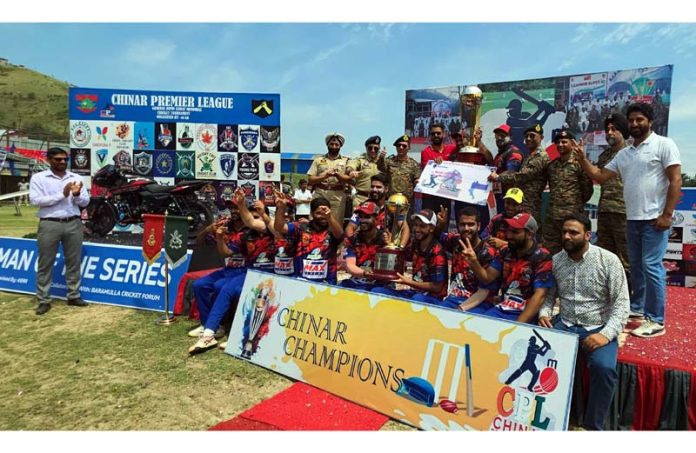 Winning team posing with trophy alongside dignitaries during post match presentation. Winning team posing with trophy alongside dignitaries during post match presentation.