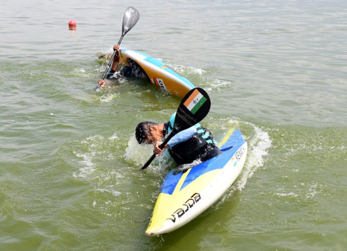 National athletes practice in Dal lake Srinagar ahead of the first-ever Khelo India Water Sports Festival. — Excelsior/Shakeel