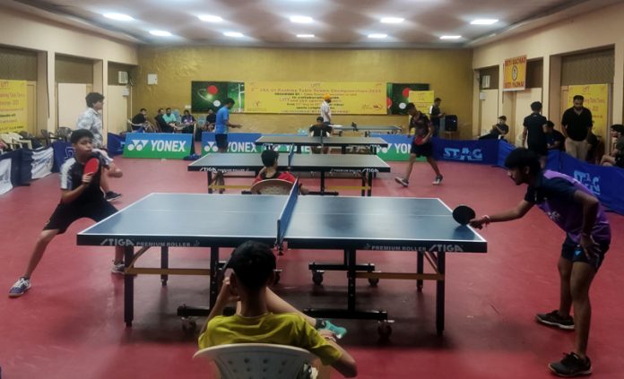Table Tennis players in action during a match. Table Tennis players in action during a match.