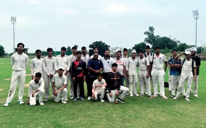 Players of Janta Sports Club posing together after winning a match. Players of Janta Sports Club posing together after winning a match.