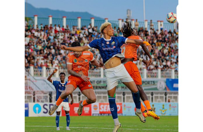 Players in action during a football match between RKFC and Neroca FC in Imphal on Sunday.