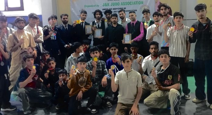 Winners posing along with medals during closing ceremony.