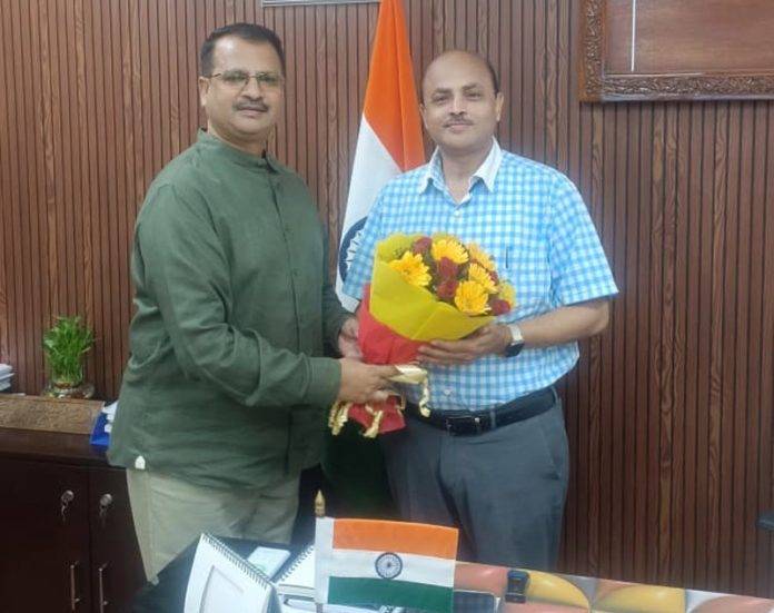 BJP leader, Rakesh Mahajan meeting Divisional Railway Manager, Jammu, Vivek Kumar on Friday.